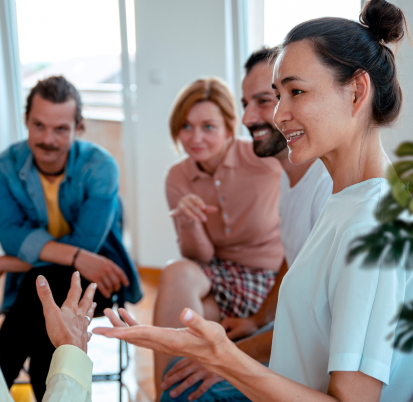 A group of men and women talking